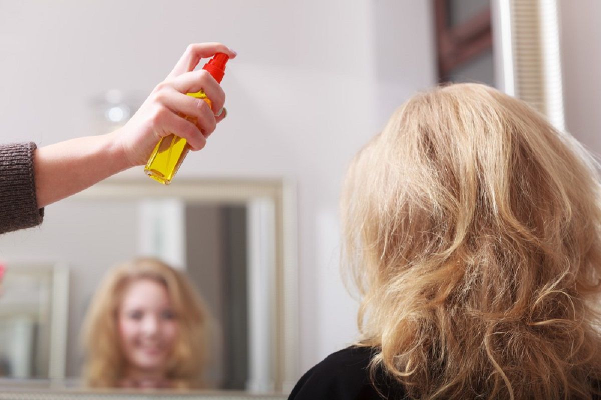 Applying Spray To The Hair